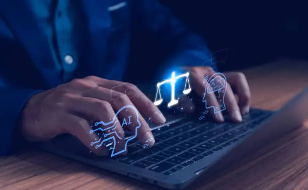 Hands typing on laptop with glowing AI